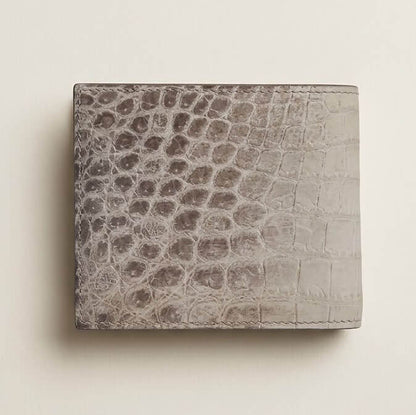 Back panel of the bespoke Himalayan crocodile bifold wallet, highlighting organic circular scale patterning and hand-finished matte painted edges.